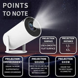 Home & Beyond Co portable projector displaying a movie on a white wall in a cozy living room setting.