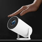 Home & Beyond Co portable projector showing a bright image projected onto a wall in a home entertainment setup.