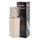 Home & Beyond Co kitchenware knife set with stainless steel blades and wooden handles arranged on a countertop.