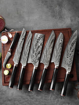 Home & Beyond Co Damascus steel chef's knife set with multiple knives displayed on a cutting board.