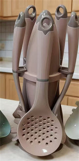Home & Beyond Co kitchenware knife set with various stainless steel knives and a wooden block for countertop storage.
