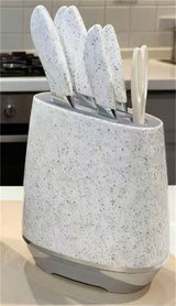 Home & Beyond Co kitchenware knife set with stainless steel blades and ergonomic handles arranged on a wooden countertop.