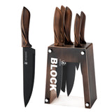 Stainless steel chef knife set by Home & Beyond Co featuring multiple knives with black handles on a wooden surface.