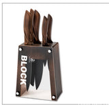 Stainless steel chef knife set from Home & Beyond Co with multiple knives displayed on a wooden kitchen countertop.