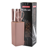 Home & Beyond Co kitchenware knife set featuring stainless steel knives with black handles on a wooden countertop.