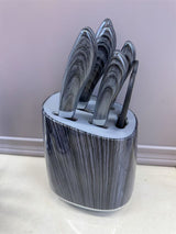 Home & Beyond Co kitchenware knife set with stainless steel blades and wooden handles on a countertop.