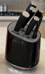 Home & Beyond Co kitchenware knife set with stainless steel blades and black handles, displayed on a wooden countertop.