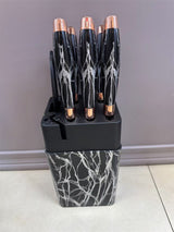 Home & Beyond Co kitchenware knife set with multiple stainless steel knives displayed on a wooden block.