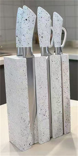 Home & Beyond Co kitchenware knife set with stainless steel knives arranged in a wooden block on a countertop.