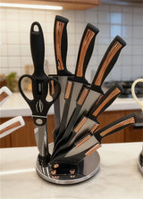 Home & Beyond Co kitchenware knife set with stainless steel blades and wooden handles, displayed on a countertop.