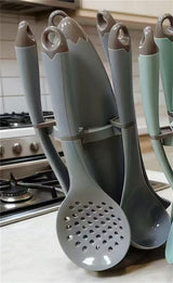 Home & Beyond Co kitchenware knife set with multiple stainless steel knives displayed on a wooden countertop.