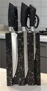 Home & Beyond Co kitchenware knife set with stainless steel blades and black handles on a wooden cutting board.