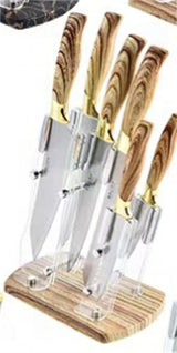 Home & Beyond Co kitchenware knife set with stainless steel blades and black handles, displayed on a wooden countertop.