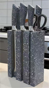 Home & Beyond Co kitchenware knife set with stainless steel blades and black handles displayed on a kitchen countertop.