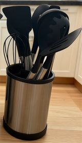 Home & Beyond Co kitchenware knife set with stainless steel blades and black handles, displayed on a wooden kitchen countertop.