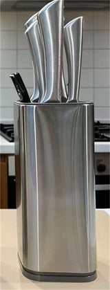Home & Beyond Co kitchenware knife set with stainless steel knives and wooden block on a countertop.