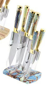 Home & Beyond Co kitchenware knife set with multiple stainless steel knives and black handles on a wooden countertop.