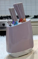 Home & Beyond Co kitchenware knife set with stainless steel blades and black handles on a wooden countertop.