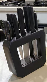 Home & Beyond Co kitchenware knife set with stainless steel knives and black handles on a wooden kitchen countertop.