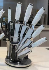 Home & Beyond Co kitchenware knife set with various stainless steel knives arranged on a cutting board.