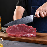 Damascus chef kitchen knife set with multiple knives featuring patterned blades and black handles, ideal for professional cooking.