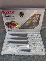 Home & Beyond Co kitchenware knife set featuring stainless steel blades and black ergonomic handles on a wooden countertop.