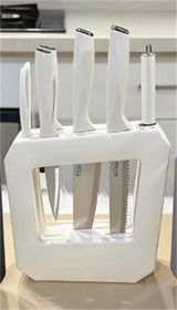 Home & Beyond Co kitchenware knife set with stainless steel blades and ergonomic handles, arranged on a wooden countertop.