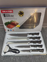 Home & Beyond Co kitchenware knife set with stainless steel knives, including chef and paring knives on a wooden countertop.
