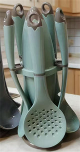 Home & Beyond Co kitchenware knife set with multiple stainless steel knives and wooden block for countertop storage.